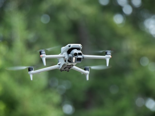 DJI Matrice 4E drone in flight during field data collection