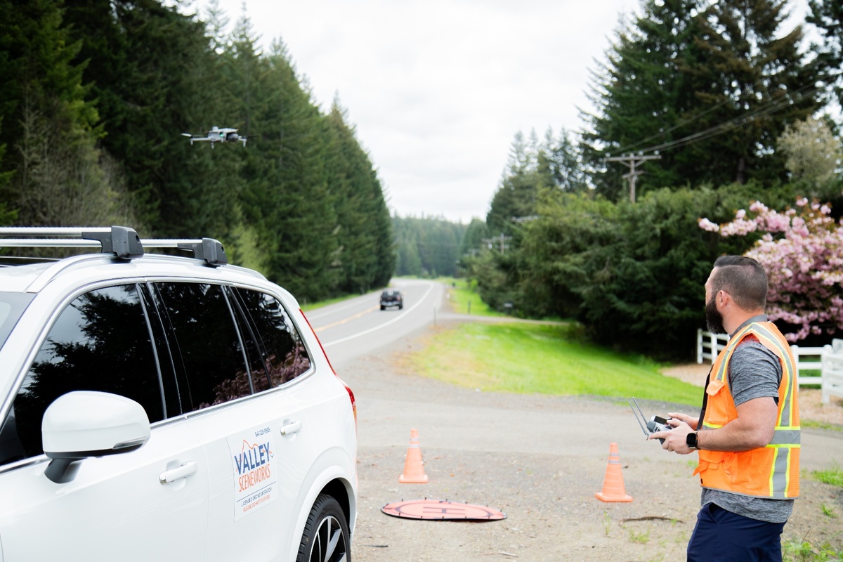 Valley Sceneworks drone operator on-site with branded vehicle and landing pad